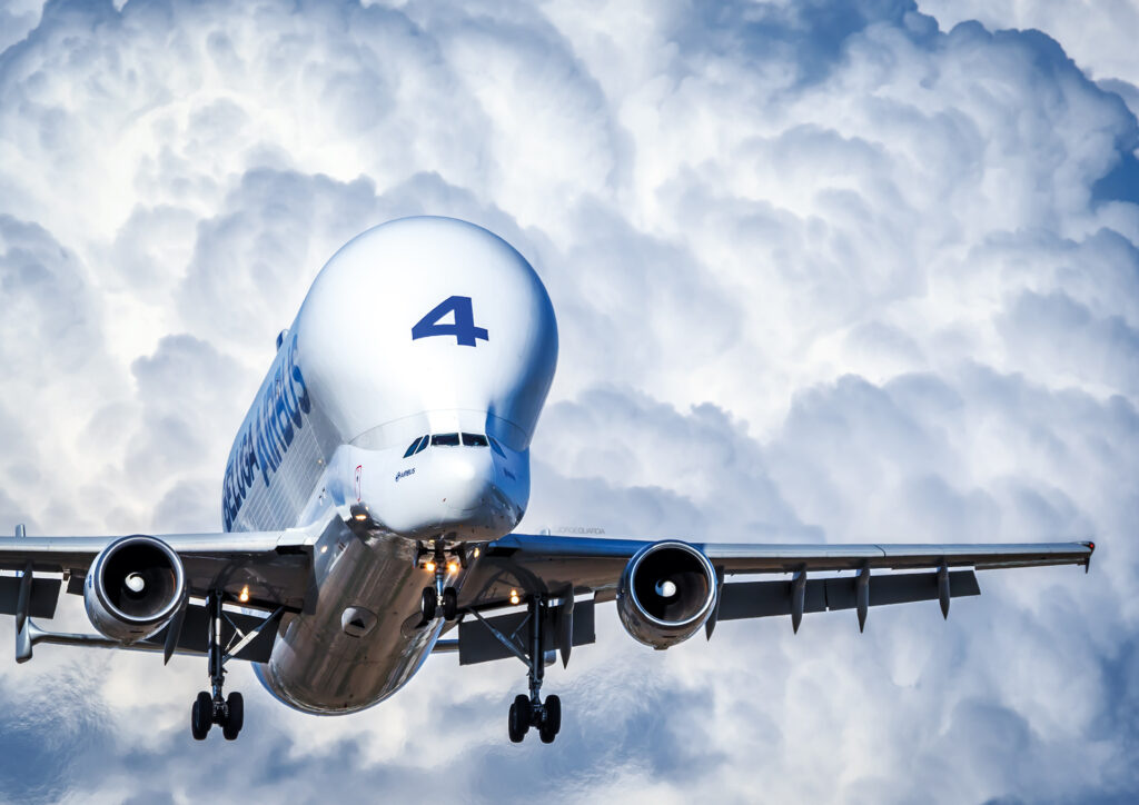 Airbus A300-600ST Beluga landing at Madrid Getafe with a Cumulonimbus cloud in the background