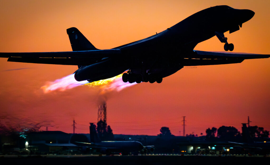 Rockwell B-1 Lancer taking off at Sevilla during sunrise with full afterburner