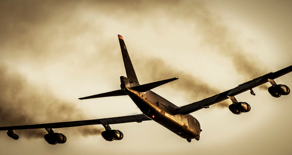Back view of a Boeing B-52 Stratofortress taking off at Sevilla