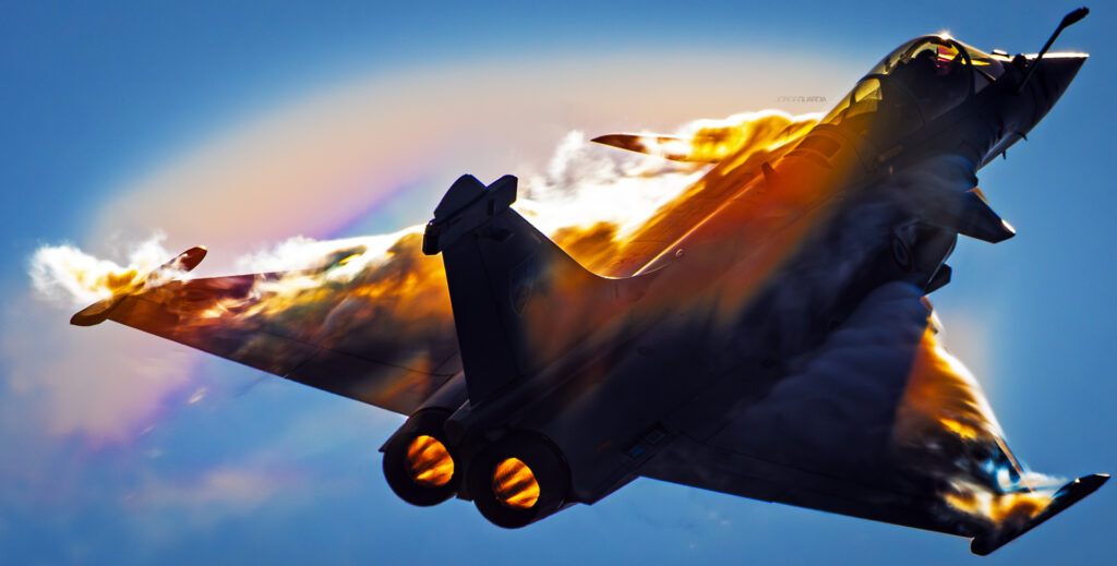 Dassault Rafale from the Armée de l'air et de l'espace demo team creating rainbows during display at Gijon, Spain