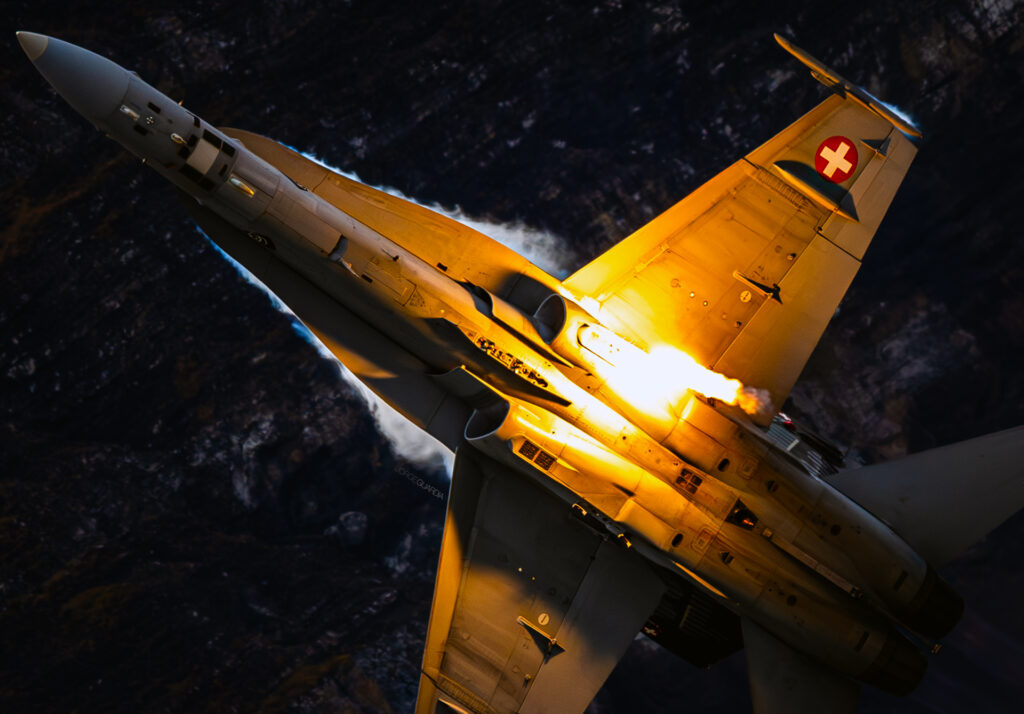 Swiss Air Force F18 launching flares during AXALP airshow