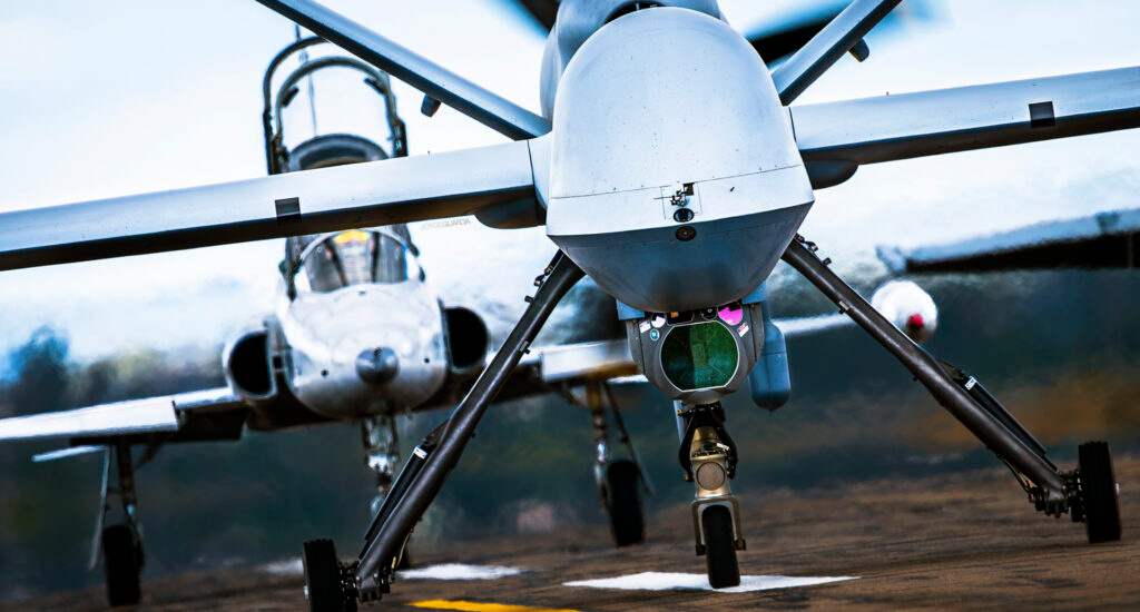 Spanish Air Force MQ9 Predator drone in front of a Northrop F-5