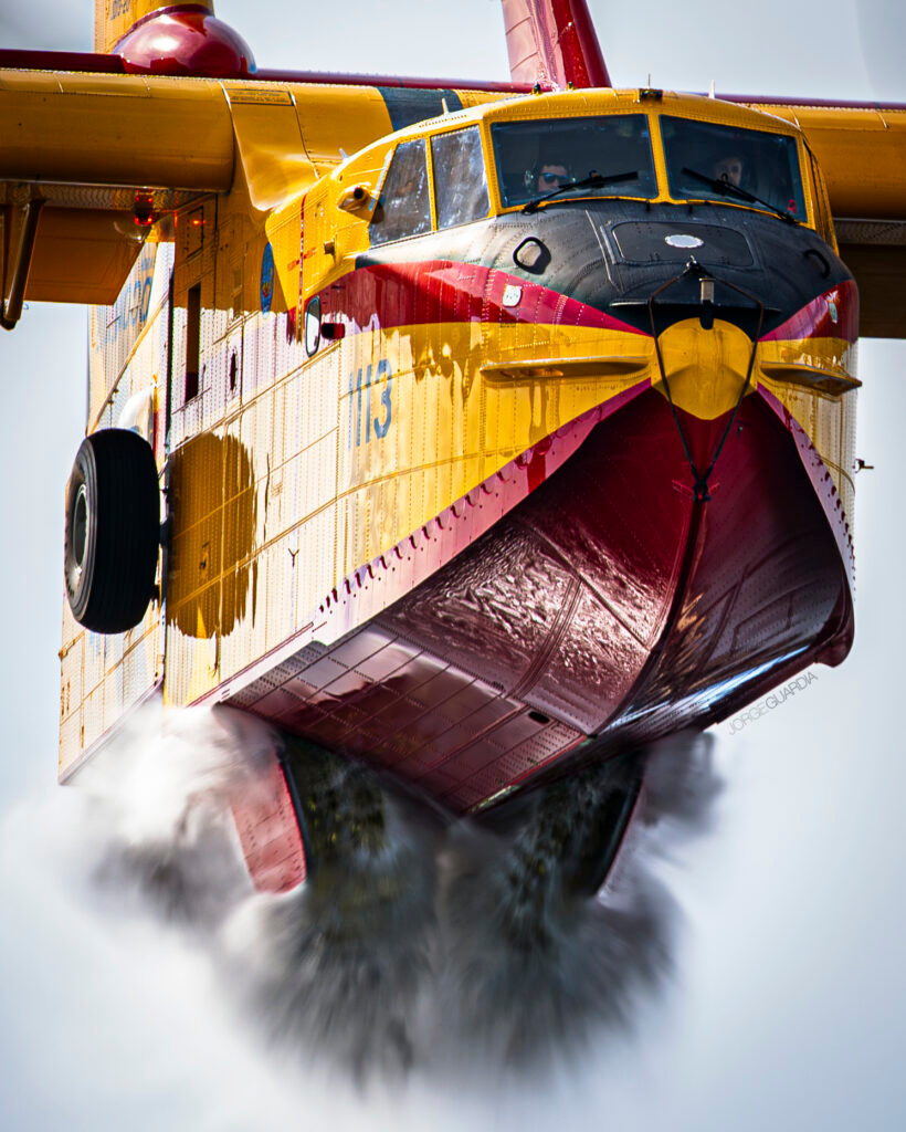 Spanish Air Force Canadair CL-215T opening the discharge doors and dropping water